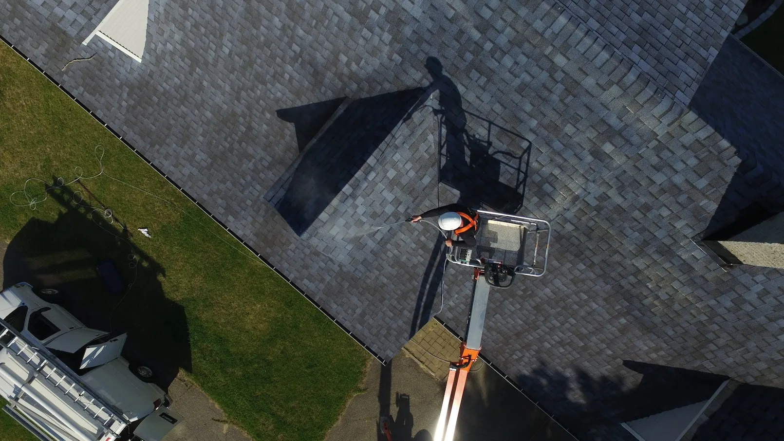 Go Nano roof spray protectant being applied to shingles